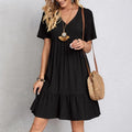 A loose, casual short-sleeved flowing dress for women
